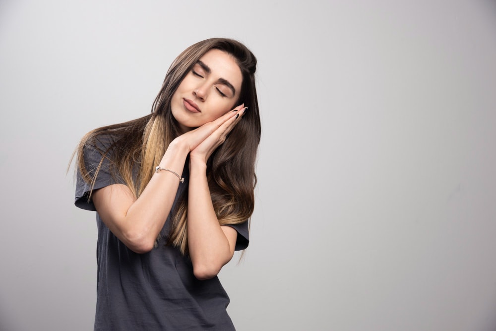 How To Fall Asleep Fast In 2024 The Sleep Company   Portrait Young Woman Peacefully Sleeping Shot Gray Background 